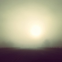 foggy sunrise over a highway