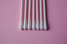 cotton swabs on the pink background, cosmetic  and hygiene