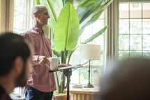 man leading a discussion at a home Bible study 