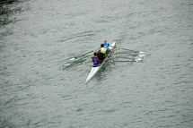 athletes training in canoe in the river