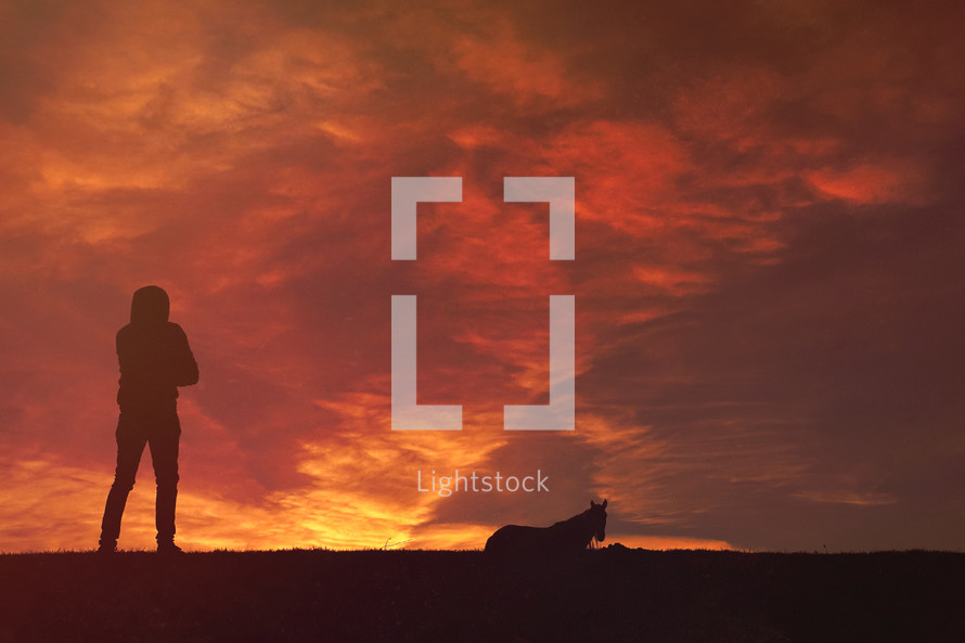 man hikking in the countryside and sunset background