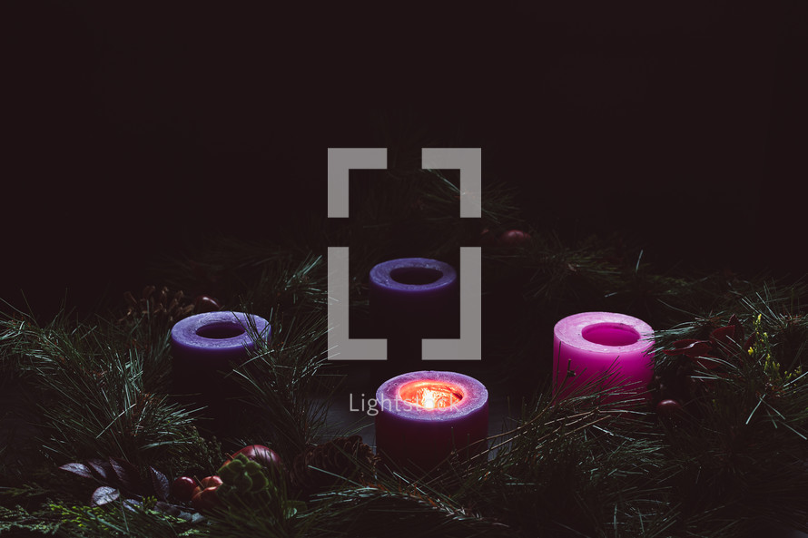Rustic advent wreath with one candle lit