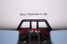 words Happy Valentine's Day typed on a typewriter 