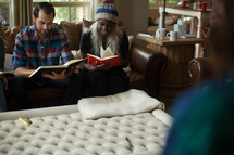 man and women reading Bibles at a fall Bible study 