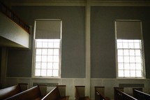 rows of empty church pews 