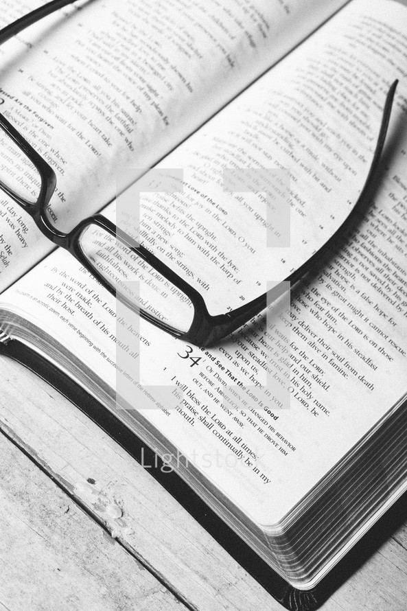 reading glasses on a Bible - seeking clarity