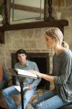 A young woman leading a home Bible study.