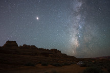 stars in the night sky over the desert 
