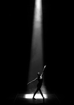 dancer under the spot light on stage