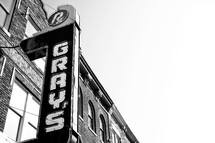 Grays' drug store marquee sign against building.
