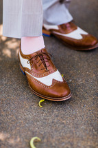 brown and white wing tip dress shoes men fashion clothing