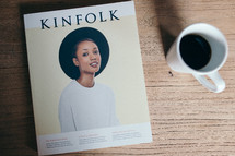 Kinfolk book on a coffee table and coffee mug