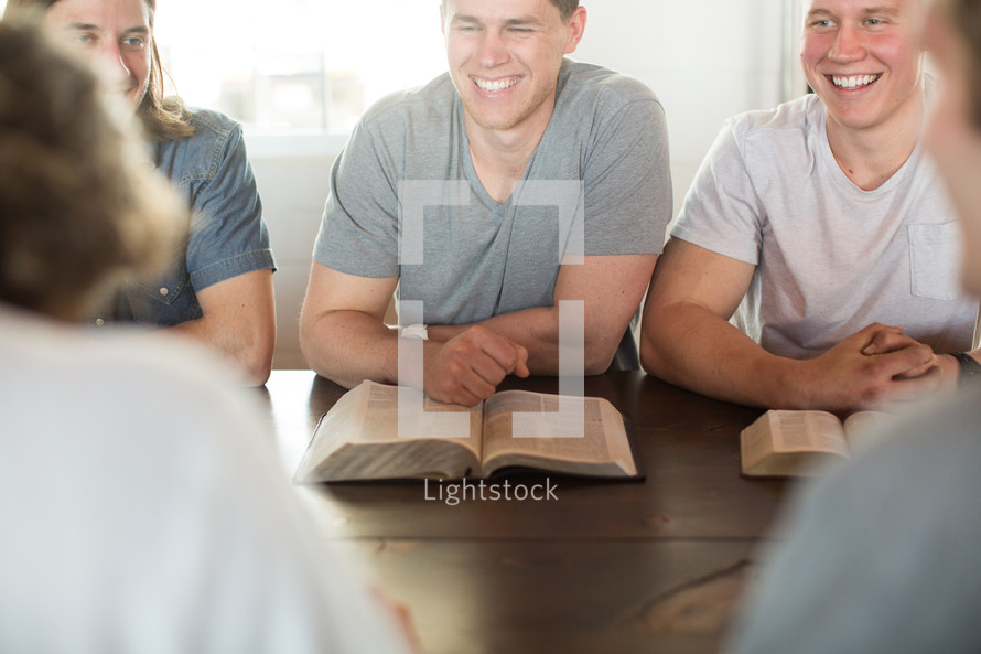 men laughing at a men's group Bible study.