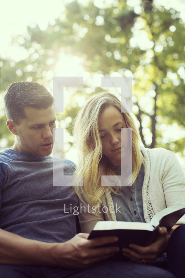 couple reading a Bible together 