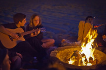 singing by a campfire