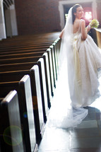 bride walking down the aisle of an empty church