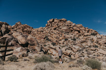 a man exploring a rocky terrain 