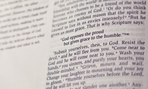 Bible open to James 4:6 -- "God opposes the proud but gives grace to the humble."