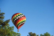 colorful hot air balloon in a blue sky 
