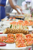 appetizers and finger foods on a buffet table 
