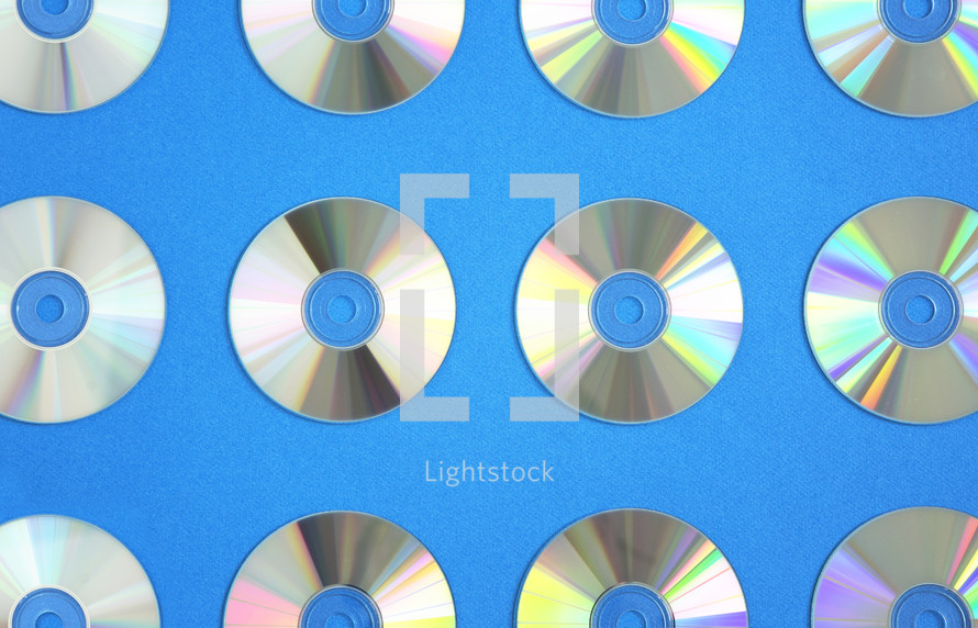 cd's on a blue background 