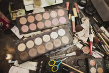A pile of make-up and brushes