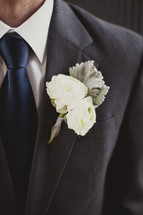 A close-up of a man's boutonniere 