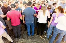 Group prayer crowd salvation believers standing hands