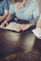 men reading Bibles at a men's group Bible study