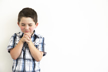 a boy child in prayer 