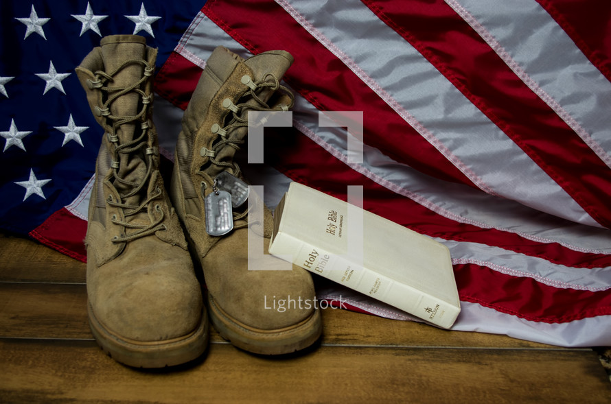 Holy Bible, American flag, boots, and military dog tags