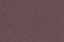 Burgundy textured background with flecks of color