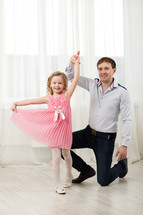 Little princess dancing with father