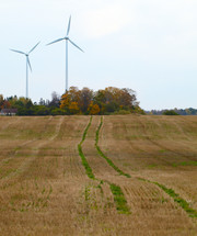 Two wind turbines in the field