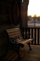 Bench on a wooden porch.