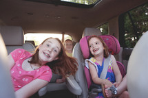 children riding in the backseat 