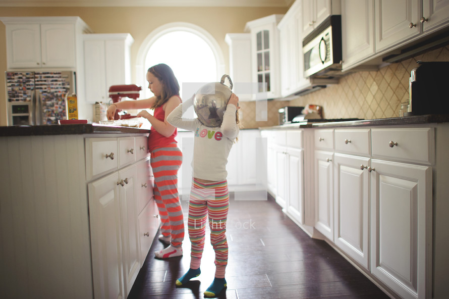 girls in pajamas in a kitchen 