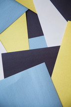 sheets of blue and yellow paper 