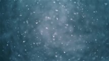 Real snow falling in winter. It is snowing bokeh nature background