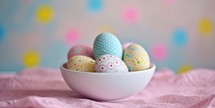 Colorful easter eggs in a white bowl on a pink background