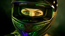 Young female motorcyclist woman in closed motorcycle helmet. Driver biker looking to camera under green colorful neon light with smoke or steam at night. Amazing aesthetic portrait. High quality photo
