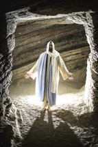 Jesus standing at the entrance of a tomb