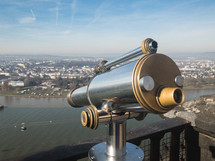 rooftop telescope looking out over a river 