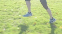 legs of a man running 