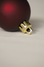 a single red Christmas ornament on a white background 