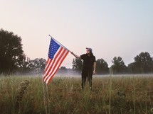 man holding an American Flag