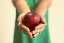 woman holding an apple 