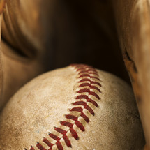 a baseball in a glove 