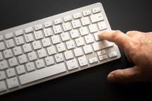 finger on a keyboard 