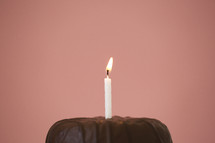 birthday candle on a chocolate cake 